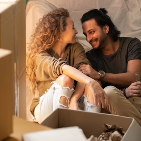 Two tenants sitting with moving boxes